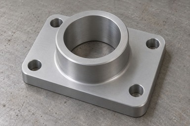 AI-generated illustration of a grey machined aluminium carrier with a rectangular mounting flange, four plain fixing holes and a raised cylindrical boss surrounding a central through bore.